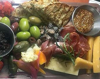 Product: Caper berries, pickled vegetables, Mediterra heartland grain bread, Frascatrano olives house fig jam, cured meats with citrus olive oil, Marconi almonds, maille mustard and artisan cheeses - Phoenix City Grille in Madison - Phoenix, AZ American Restaurants