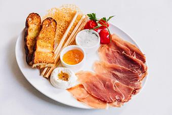 Product: served with orange marmalade, prosciutto butter, whipped ricotta & honey, toasted focaccia, grissini & parmesan frico - Pizzeria Portofino in Chicago, IL Pizza Restaurant