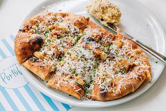 Product: housemade pizza dough, garlic confit, sprinkled with rosemary, parmesan - Pizzeria Portofino in Chicago, IL Pizza Restaurant