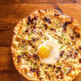 Product: Nueske's Black-Peppered Bacon Pizza - Osteria Via Stato in River North - Chicago, IL Italian Restaurants