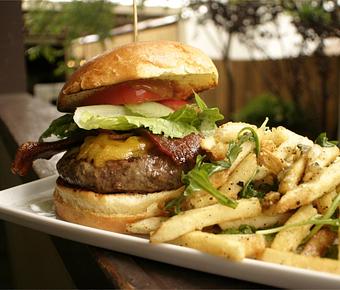 Product: Grilled 10oz of Ground Waygu Beef on toasted Bun with tangy BBQ topped with cheddar, housemade candied bacon, romaine and ripe tomato. Yes fries too! NOTE: We don’t cook it over med. - PUBlic House in Old Town Temecula - Temecula, CA American Restaurants