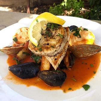 Product: This is one example of what you might experience in a daily Chef Fish Special.  Grilled Swordfish, crispy fried red potatoes, ciopinno broth, muscles and clams.  Check out daily Specials on our Instagram: #publichousetemecula - PUBlic House in Old Town Temecula - Temecula, CA American Restaurants