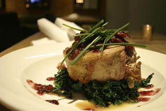 Product: Duroc pork loin stuffed w/ roasted duck over garlic wilted greens drizzled with sherry port reduction - PUBlic House in Old Town Temecula - Temecula, CA American Restaurants