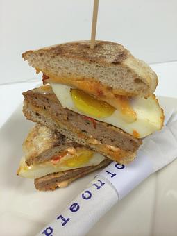 Product: roasted egg, provolone, sun-dried tomato mayo, whole wheat english muffin and choice of breakfast meat - Purple Onion Cafe in Downtown Los Gatos - Los Gatos, CA American Restaurants