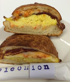 Product: scrambled eggs, swiss, sun-dried tomato mayo and choice of breakfast meat - Purple Onion Cafe in Downtown Los Gatos - Los Gatos, CA American Restaurants