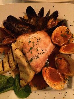 Product: Black Sea Bass with Mussels and Clams - Rachel's Cafe in Syosset, NY American Restaurants