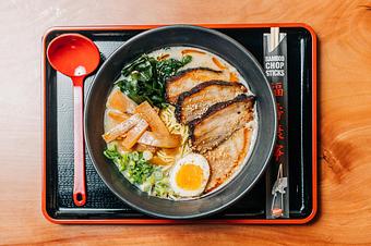 Product: our most traditional ramen. rich and hearty pork broth, tokyo wavy noodles, green onion, pork belly, wakame seaweed, molten egg, bamboo shoots, fried garlic and sesame seeds - Ramen San in Chicago, IL Restaurants/Food & Dining