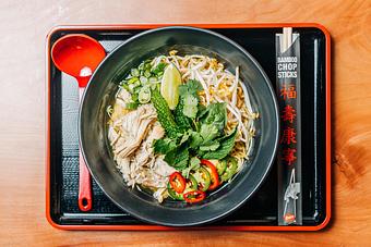 Product: featuring our classic chicken broth fortified with vietnamese spices, ramen noodles are topped with poached chicken, chiles, bean sprouts, fresh herbs, and seasoned with lime juice and fish sauce - Ramen San in Chicago, IL Restaurants/Food & Dining