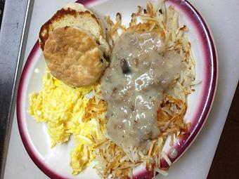 Product: This is our egg classic with sausage gravy on the hashbrowns - Raymary Street Grill in Bokeelia - Bokeelia, FL American Restaurants