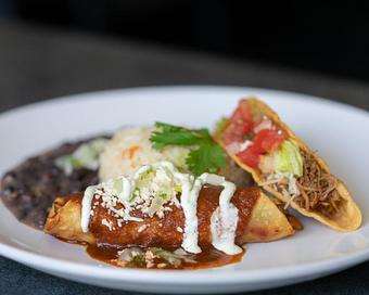 Product: SHREDDED CHICKEN OR BEEF CRISPY TACO, CHICKEN OR CHEESE ENCHILADA WITH SALSA ROJA, QUESO FRESCO, CILANTRO-ONION AND CREMA. SERVED WITH BLACK BEANS AND CILANTRO RICE - Red Mesa Restaurant in St Petersburg, FL Mexican Restaurants