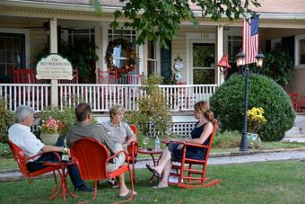 Product: Guests enjoying the front yard - Red Rocker Inn in Black Mountain, NC American Restaurants