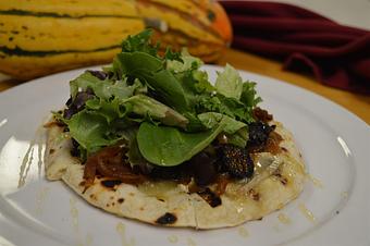 Product: Home made flatbread with Brie cheese, figs, and greens - Red Rocker Inn in Black Mountain, NC American Restaurants