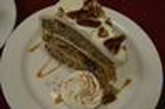 Product: bananas, pineapple, pecans, and cinnamon cake with cream cheese frosting - Red Rocker Inn in Black Mountain, NC American Restaurants