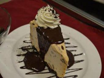 Product: Oreo cookie crust, peanut butter ice cream with chopped Reese's cups, hot fudge sauce, whipped cream - Red Rocker Inn in Black Mountain, NC American Restaurants