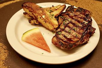 Product: Steak w/Grecian Potatoes - Relish in Grinnell, IA American Restaurants