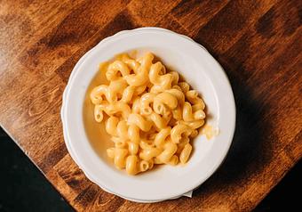 Product: a bowl of cheesey mac and cheese in a white bowl - RJ Grunts in Lincoln Park - Chicago, IL American Restaurants