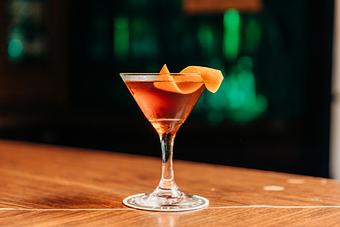 Product: a hanky panky cocktail in a martini class with an orange peel garnish - RJ Grunts in Lincoln Park - Chicago, IL American Restaurants