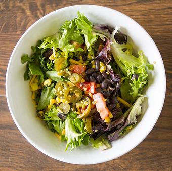 Product: Our popular avocado vinaigrette tops the southwest perfectly. - Romaines in Missoula, MT American Restaurants