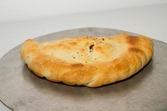 Product: Traditional Calzone - Ropa's Chicago Style Pizza in Wausau, WI Pizza Restaurant