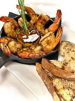 Product: Garlic and Rosemary Rubbed Shrimp, Hot Sauce-Spiked Worcestershire Butter, Charred Lemon & Grilled Ciabatta - Savour in Tallahassee, FL American Restaurants