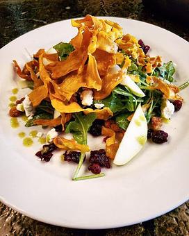 Product: Mixed Greens, Candied Walnuts, Goat Cheese, Fennel, Granny Smith Apples, Dried Cranberries, Lemon-Basil Vinaigrette, Crispy Sweet Potato Ribbons - Savour in Tallahassee, FL American Restaurants