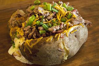 Product: Chopped Baker with Brisket, Butter, Sour Cream, Cheddar Cheese and Chives - Smokey Mo's BBQ in San Antonio, TX Barbecue Restaurants