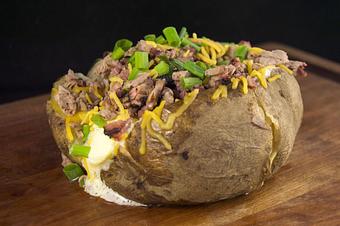 Product: Chopped Baker with Brisket, Butter, Sour Cream, Cheddar Cheese and Chives - Smokey Mo's BBQ in San Antonio, TX Barbecue Restaurants