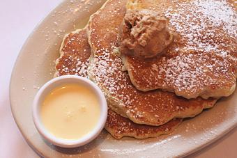 Product: pancakes made of super gooey bread pudding with cinnamon-sugar butter & vanilla anglaise - Southport Grocery & Cafe in Lakeview - Chicago, IL American Restaurants