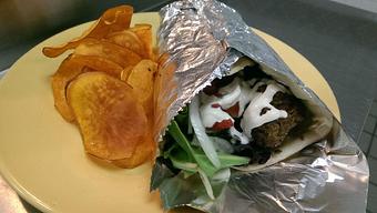 Product: Lamb with hummus, lettuce, tomato, cucumber, onion and tahini on naan or spiced roti. - Spice Restaurant in Truckee, CA American Restaurants Product: Lamb with hummus, lettuce, tomato, cucumber, onion and tahini on naan or spiced roti. - Spice Restaurant in Truckee, CA American Restaurants