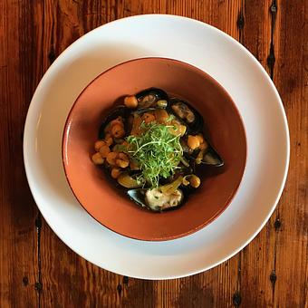 Product: Guazzetti: Cape Bay Mussels—Chickpeas ~ smoked Italian peppers ~ saffron broth - Spiga Ristorante in Needham Heights, MA Italian Restaurants