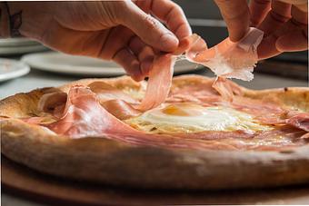 Product: prosciutto and egg pizza - Stella Barra Pizzeria & Wine Bar in Chicago, IL Pizza Restaurant