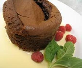 Product: The ultimate indulgence: an individual chocolate cake, served hot and bubbling. - Stellina in Watertown, MA Italian Restaurants