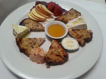 Product: Goat cheese plate with 4 unique cheeses, honey, fruit and nut bread - Stellina in Watertown, MA Italian Restaurants