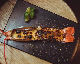 Product: half of a maine lobster served in the shell, prepared chopstick-friendly and perfectly complimented by a lime-soy glaze before being caramelized in our coal-burning oven. - Sushi San - Reservations in River North - Chicago, IL Japanese Restaurants