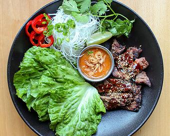 Product: prime short rib is sliced thin and marinated in korean kalbi spices. grilled over binchotan coals and served with lettuce cups, daikon, fresno chili, green onion and miso sambal - Sushi San - Reservations in River North - Chicago, IL Japanese Restaurants