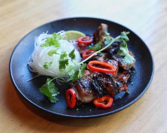 Product: berkshire pork seasoned by a heritage marinade recipe passed down from chef kaze chan’s grandmother and caramelized over binchotan charcoal. finished with fresno chili, cilantro, and green onion. - Sushi San - Reservations in River North - Chicago, IL Japanese Restaurants
