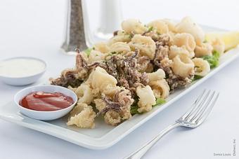 Product: Hand-breaded calamari lightly fried. - Swiss Louis in San Francisco, CA Restaurants/Food & Dining