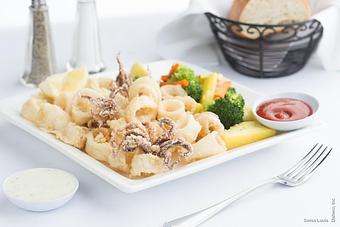 Product: Hand-breaded calamari lightly fried. - Swiss Louis in San Francisco, CA Restaurants/Food & Dining