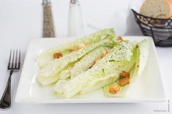 Product: Fresh croutons, parmigiana cheese and caesar dressing served over fresh romaine lettuce. *chicken additional - Swiss Louis in San Francisco, CA Restaurants/Food & Dining