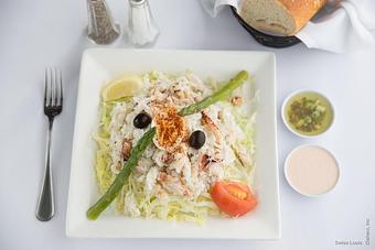 Product: Dungeness crab meat served on a bed of shredded lettuce with olives and artichokes, topped with a Louis dressing. - Swiss Louis in San Francisco, CA Restaurants/Food & Dining