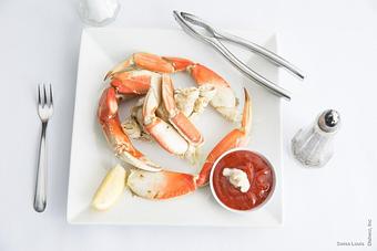 Product: Chilled half dungeness crab served with lemon and cocktail sauce. *oven roasted in fresh garlic butter sauce additional - Swiss Louis in San Francisco, CA Restaurants/Food & Dining