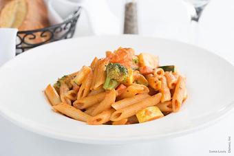 Product: Penne pasta with seasonal vegetables in a light tomato cream sauce. - Swiss Louis in San Francisco, CA Restaurants/Food & Dining