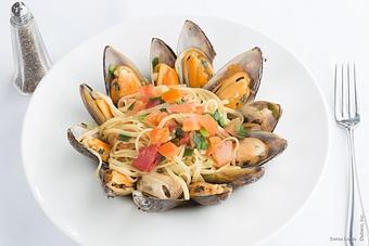 Product: Fresh clams or mussels sautéed in white wine, garlic & butter, served over linguine. - Swiss Louis in San Francisco, CA Restaurants/Food & Dining