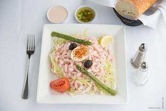 Product: Baby shrimp served on a bed of shredded lettuce with olives and artichokes, topped with a Louis dressing. - Swiss Louis in San Francisco, CA Restaurants/Food & Dining