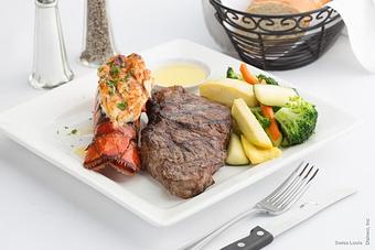 Product: Broiled New York steak and lobster tail served with sautéed vegetables. *steak topped with a madera mushroom sauce additional - Swiss Louis in San Francisco, CA Restaurants/Food & Dining