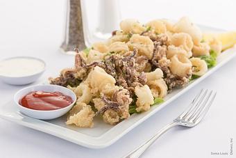 Product: Hand-breaded calamari lightly fried. - Swiss Louis in San Francisco, CA Restaurants/Food & Dining