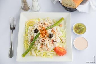 Product: Dungeness crab meat served on a bed of shredded lettuce with olives and artichokes, topped with a Louis dressing. - Swiss Louis in San Francisco, CA Restaurants/Food & Dining