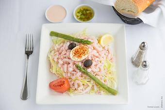 Product: Baby shrimp served on a bed of shredded lettuce with olives and artichokes, topped with a Louis dressing. - Swiss Louis in San Francisco, CA Restaurants/Food & Dining