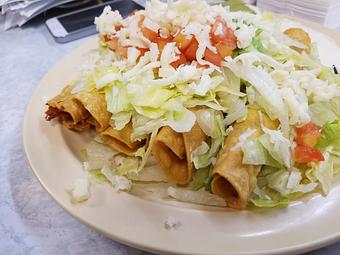 Product: 5 beef or chicken taquitos with lettuce, cheese, sour cream, guacamole and sour cream...yes please. Find this item and more on our white board menu. - Taqueria Los Gordos in Redding, CA Mexican Restaurants