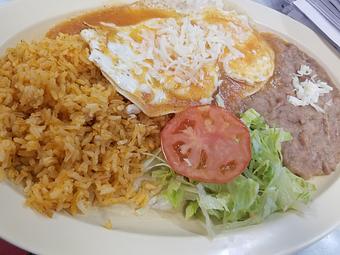 Product: This plate is eggcellent at any time of the day. Get your eggs however you please and we lay them on fried tortillas, refried beans and is topped with a fresh salsa and a sprinkle of cheese. - Taqueria Los Gordos in Redding, CA Mexican Restaurants